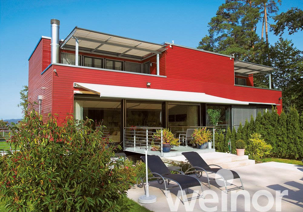 Shaded property with balcony awnings